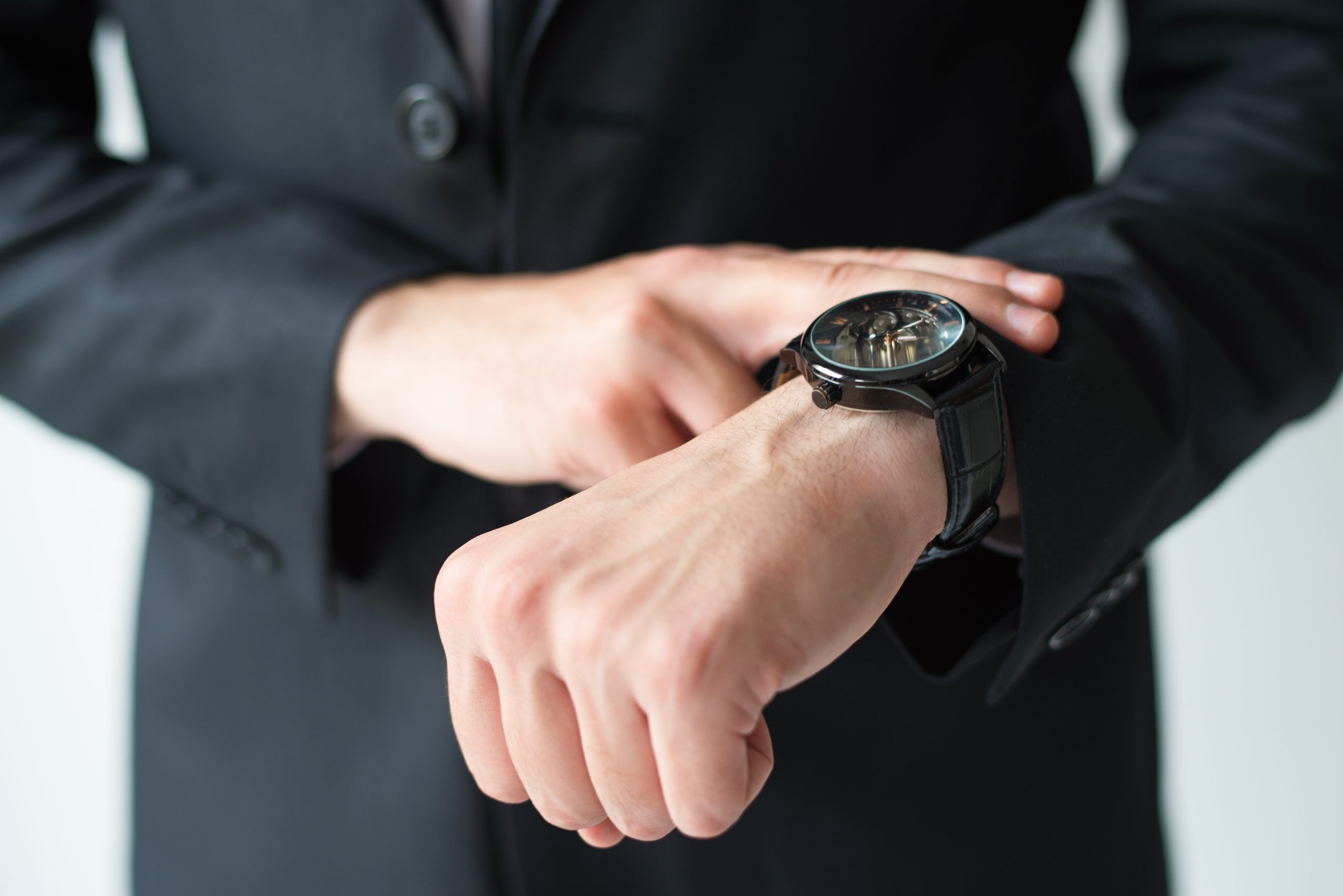 وکیل خداوردی 7 businessman consulting wristwatch scaled